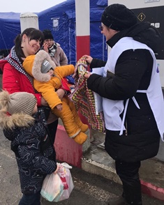 Star of Hope volunteers offer blankets at the border