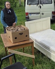A bed, chairs and some potatoes
